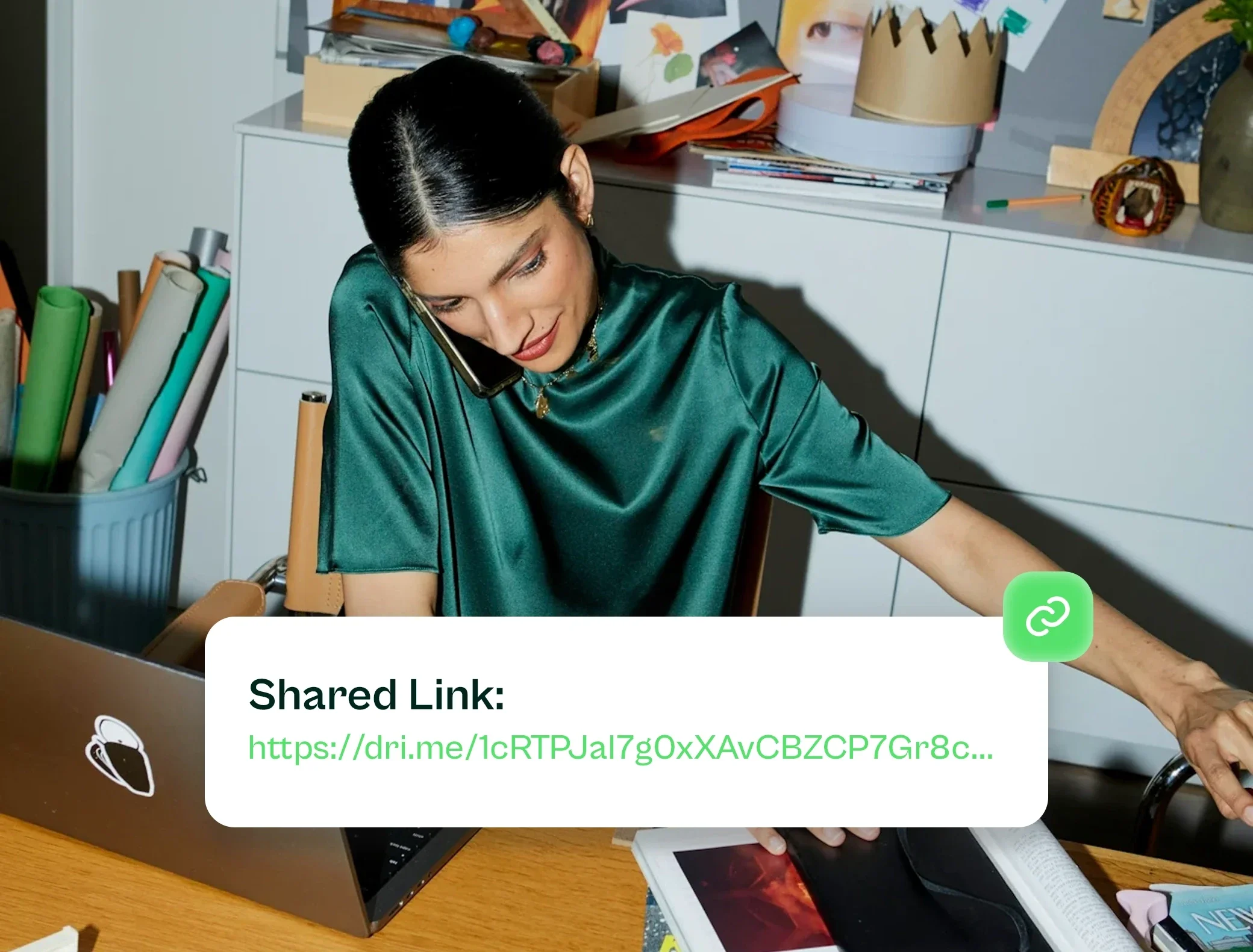 Woman on the phone at her desk, with a Drime shared link card showing a dri.me URL